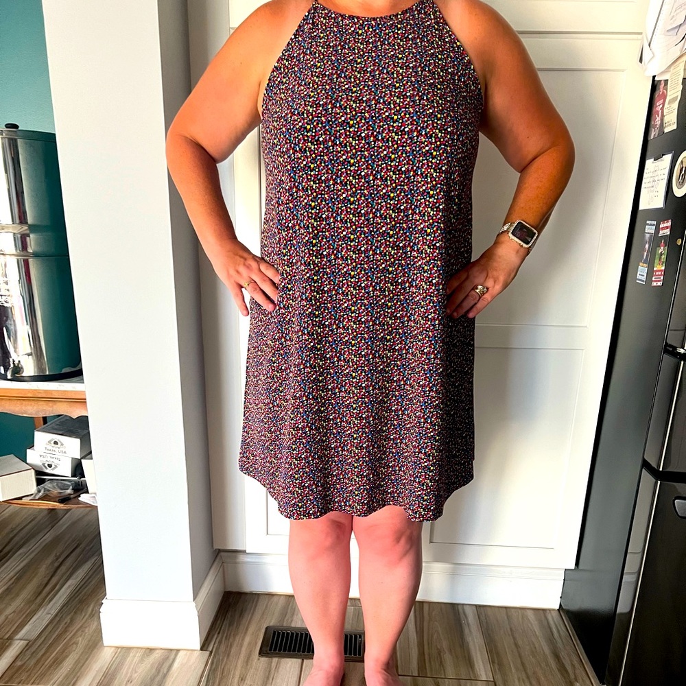 New York & Company sleeveless dress with button neck closure.